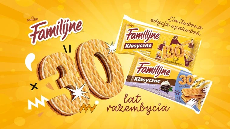 Grafika promująca 30-lecie marki Familijne, przedstawiająca wafle w kształcie liczby 30 oraz dwie limitowane edycje opakowań ciastek Familijne Klasyczne na tle żółto-pomarańczowej, radosnej kompozycji.